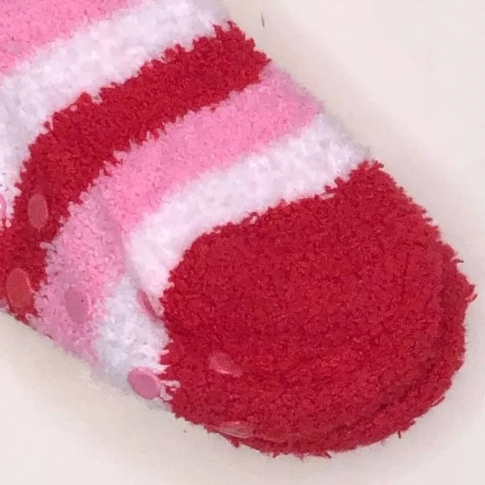 Max and Olivia Kids plush socks with gripping soles.